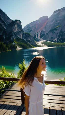 woman enjoying a beautiful view by a lake