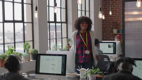 happy african american business woman celebrating success enjoying victory jumping excited colleagues clapping arms raised showing support cheerful enthusiastic teamwork in diverse office