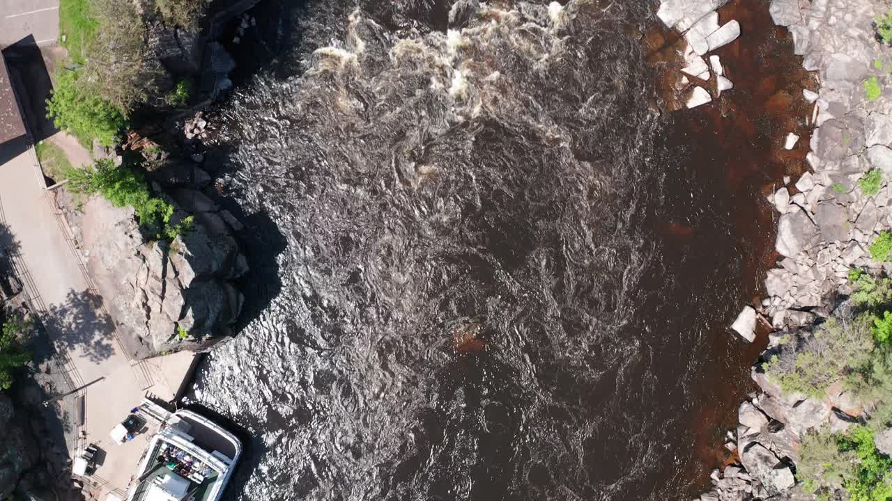 Close-up bird's eye aerial shot flying above the Saint Croix River at Taylors Falls, Minnesota