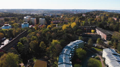 Beautiful-apartment-building-district-of-Kortedala-with-many-forest-areas,-aerial-drone-view