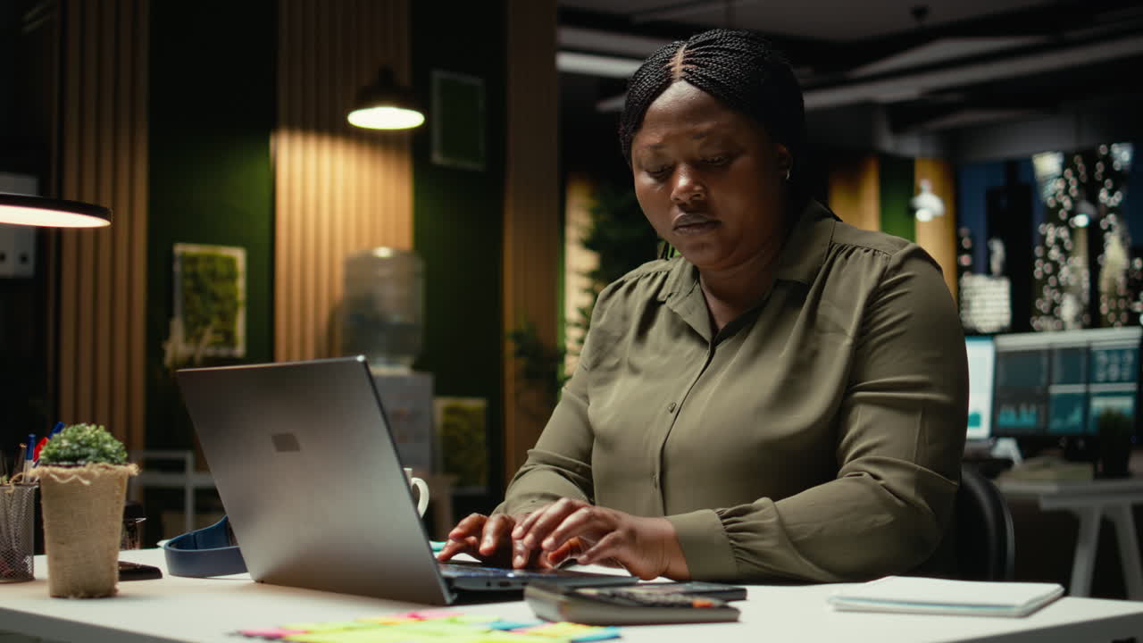 Female advisor engaged in reading emails and documenting updates