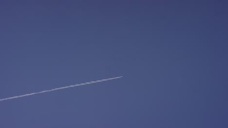 airplane contrail in a blue sky