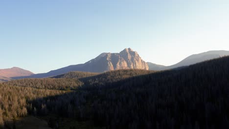 stunning aerial drone landscape nature trucking left shot of the beautiful red castle lake mountain up in the high uinta's between utah and wyoming on a backpacking trip on a clear summer evening