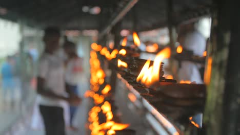 burning candles in a sri lankan temple