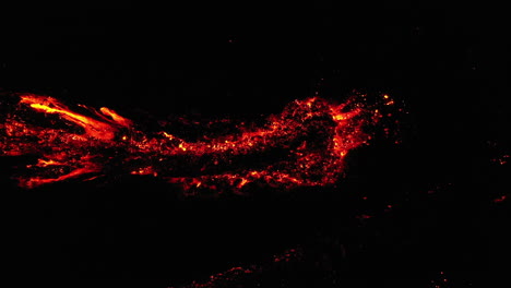 night downward angle lava or magma drone shot, active volcano mount etna sicily italy