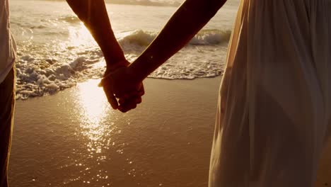 young couple by the sea