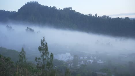 Misty Mountain Valley with Rural Village