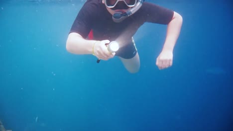 Snorkeler-Coral-reef-in-the-Maldives