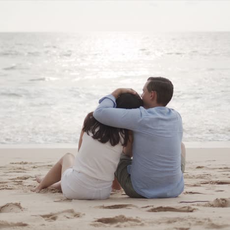 Young-lovers-on-honeymoon-hugging-at-beautiful-sea-beach