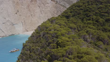 aerial - shipwreck side reveal from high in zakynthos, greece