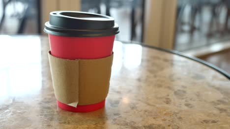 red paper coffee cup on a table