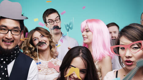 Multi-racial-group-of-funny-people-celebrating-slow-motion-party-photo-booth