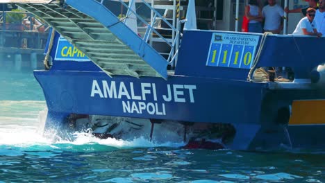 ferry approaches dock in sorrento, vibrant waters