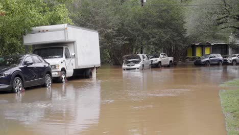 wide shot of flooded cars from hurricane helene in atlanta, georgia.