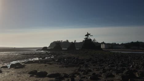 4k handheld footage of a rocky beach in oregon, usa at low tide and sunset