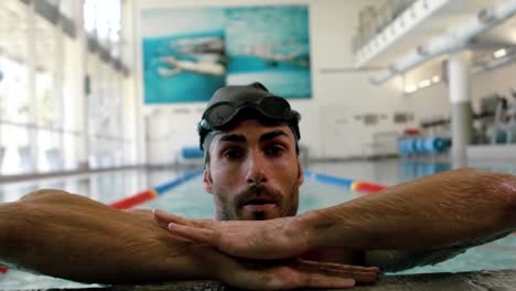 fit man in the swimming pool