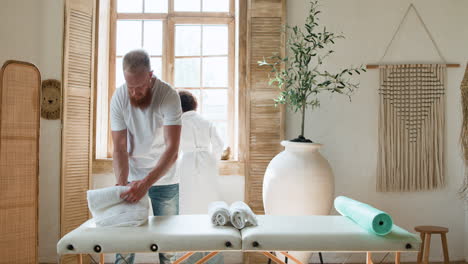 masseur preparing the room for the next client