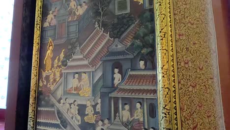 a detailed view of a vibrant temple mural in bangkok, showcasing traditional thai art and architecture with dynamic camera movement