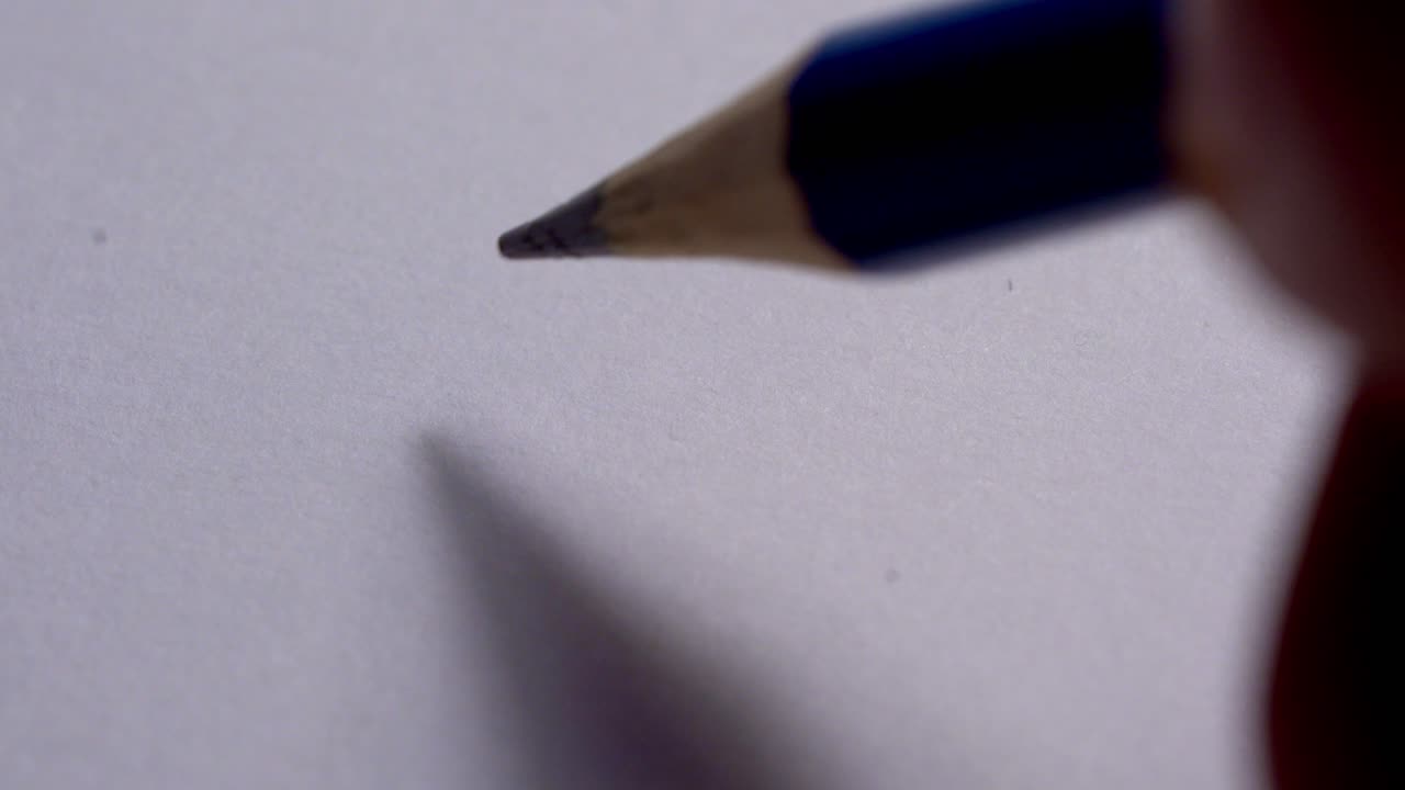 Hand writing hello on white paper sheet