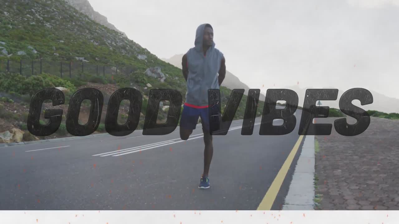 Animation of the words good vibes only in black over man exercising on mountain road