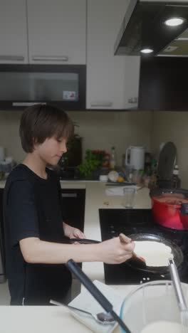 boy making pancakes