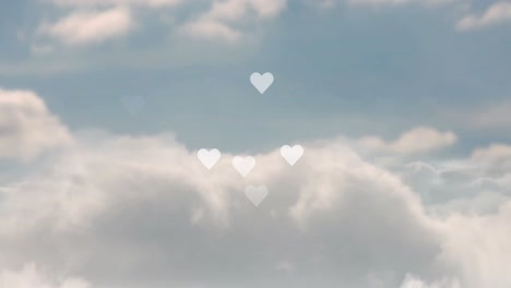 Animation-of-digital-heart-shapes-flying-over-cloudscape-in-moving-in-loop,-copy-space