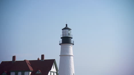 iconic maine lighthouse. zooms out to reveal flowers