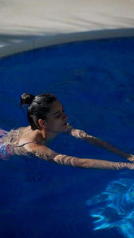 woman swimming in a pool