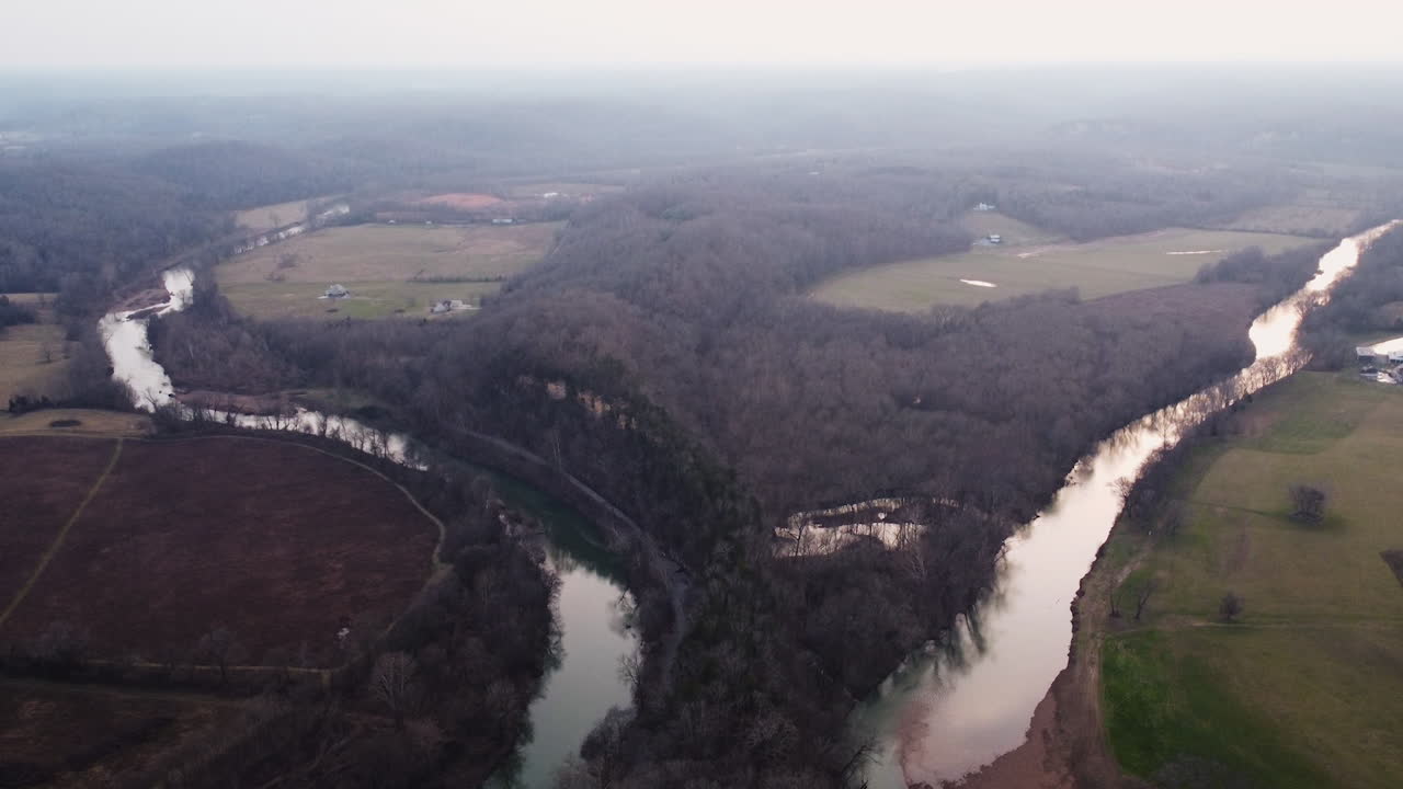 Aerial View of a Meandering River in a Rural Landscape
