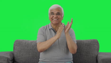 Happy-Indian-old-man-clapping-and-appreciating-Green-screen