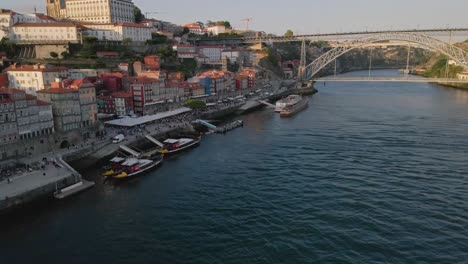 aerial of douro river near ribeira do porto, towards dom luís bridge, portugal