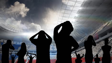 animation of silhouettes of disappointed sports fans over sports stadium