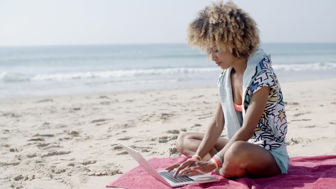 Girl Working With Laptop On The Sand Beach