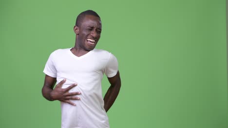 young african man having stomach ache