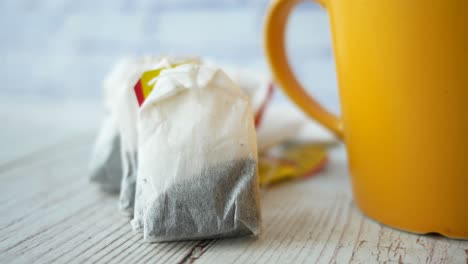 tea bags and a yellow mug