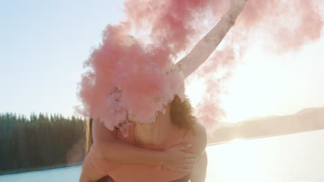 couples piggyback rides with pink smoke