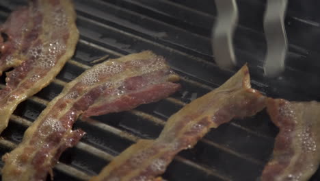 Grilling-bacon-pieces-on-hot-pan