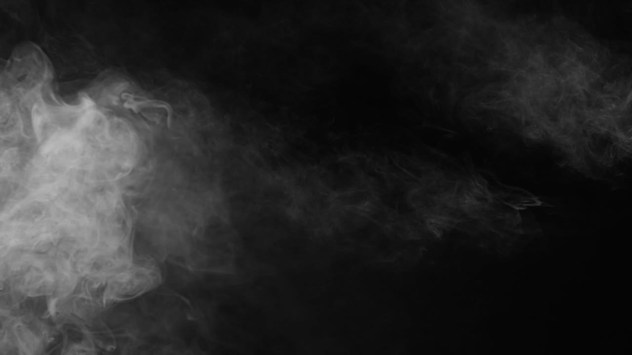 Wispy white fog drifts slowly across black screen, with thicker concentration on the left. Subtle atmospheric overlay for adding mood