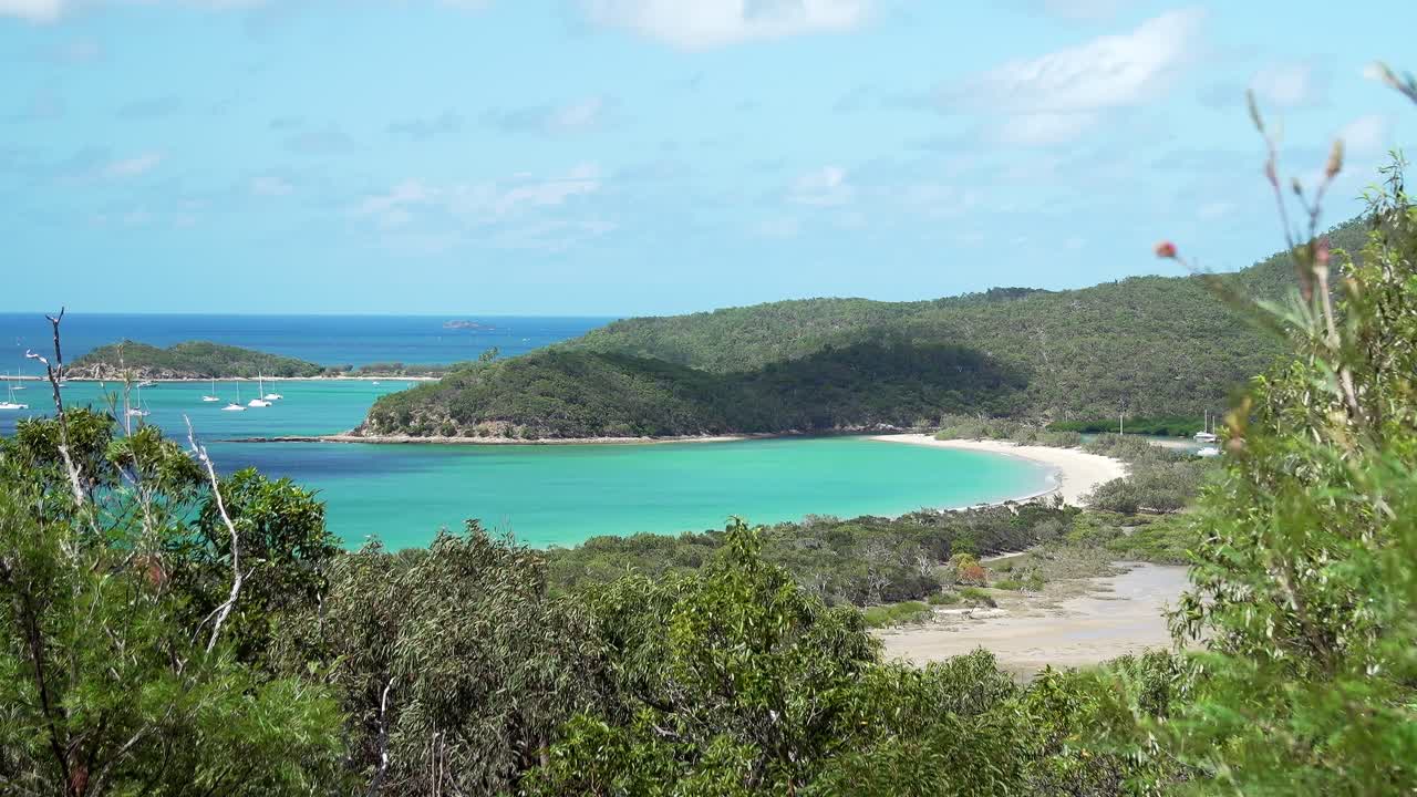 Panoramic view from the highest peak on Great Keppel Island. Sparkling aqua waters, lush tree growth, and untouched beauty make this a dream tropical getaway.
