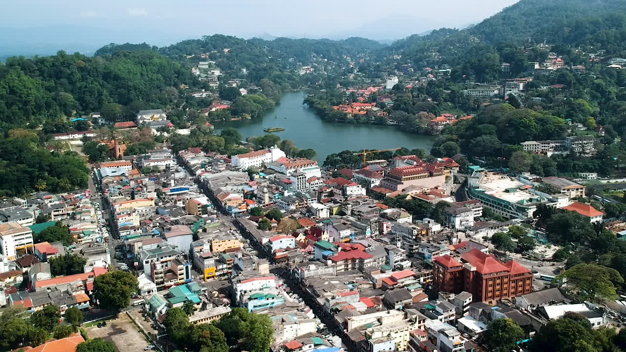 Aerial descent over Kandy city, Kandy lake and Temple of the tooth