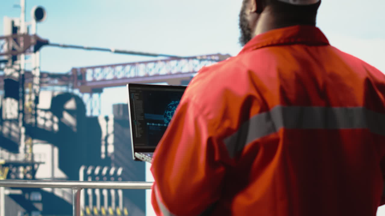 Vertical video Offshore platform crew using artificial intelligence program on laptop
