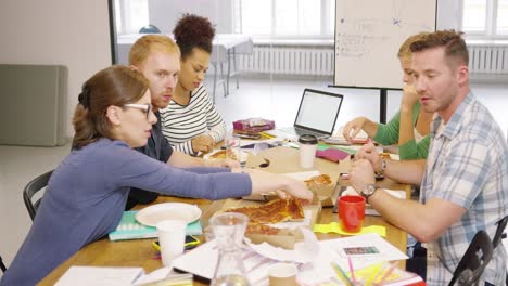 Colleagues-eating-pizza-during-break