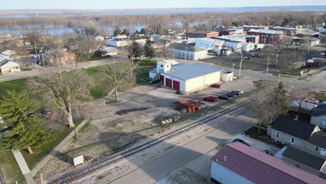 Aerial-lining-up-with-a-railroad-track-in-a-a-small-town,-Chillicothe,-Illinois