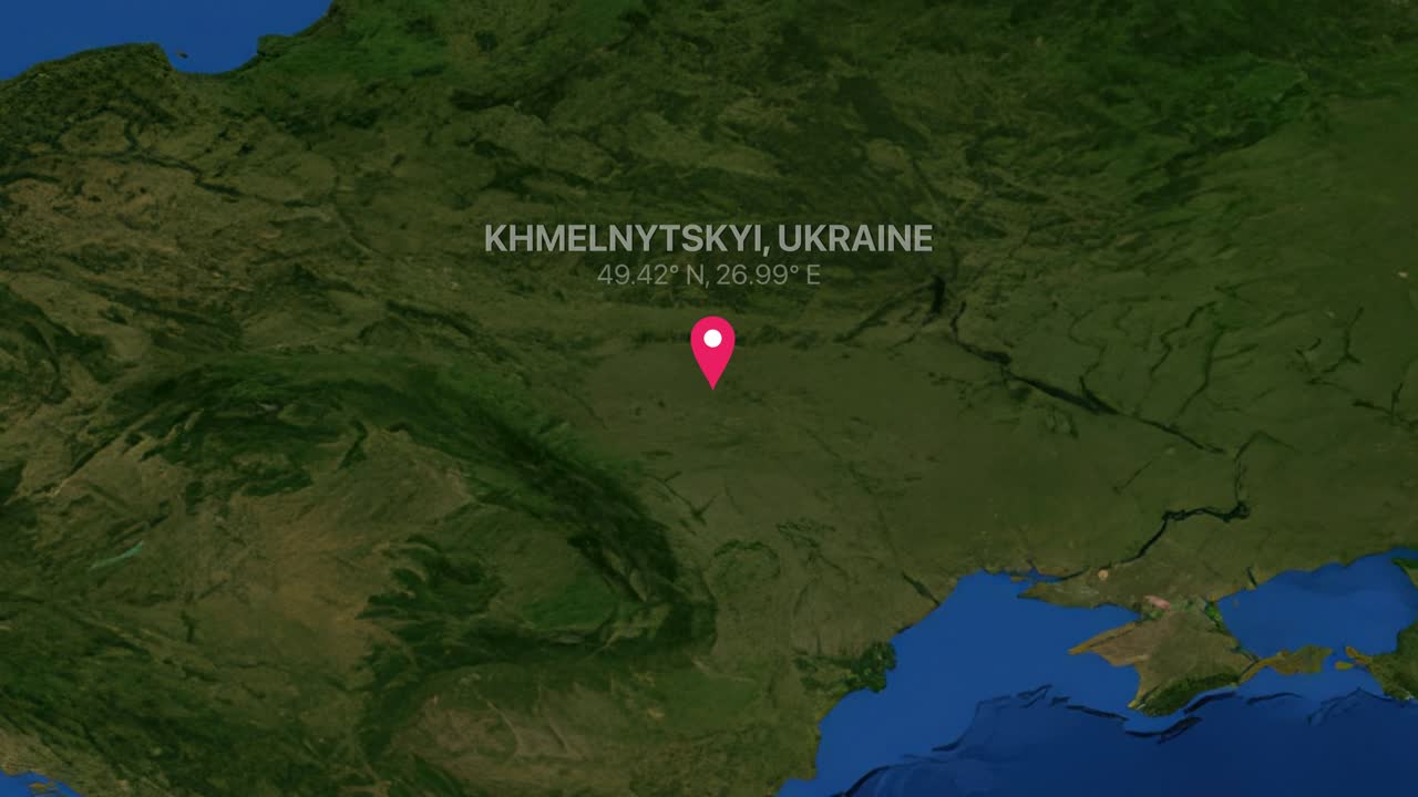 A digital earth render zooms from a global view to a specific pin in Ukraine