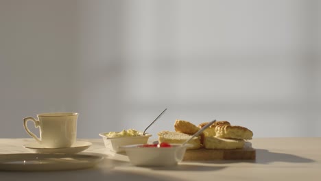 Studio Shot Of Traditional British Afternoon Tea With Scones Cream And Jam 2