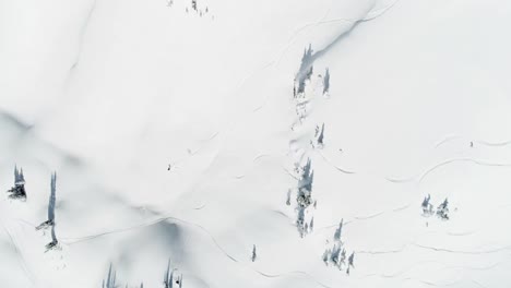 Skier-skiing-on-a-snow-capped-mountain-4k