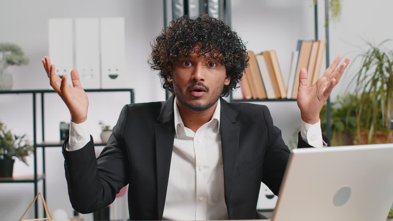 Excited amazed indian businessman showing hands brain head explosion gesture wow brainstorm idea