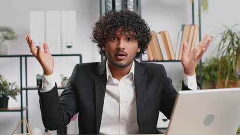 excited amazed indian businessman showing hands brain head explosion gesture wow brainstorm idea