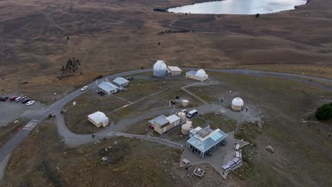 observatory buildings and snowy mountain range