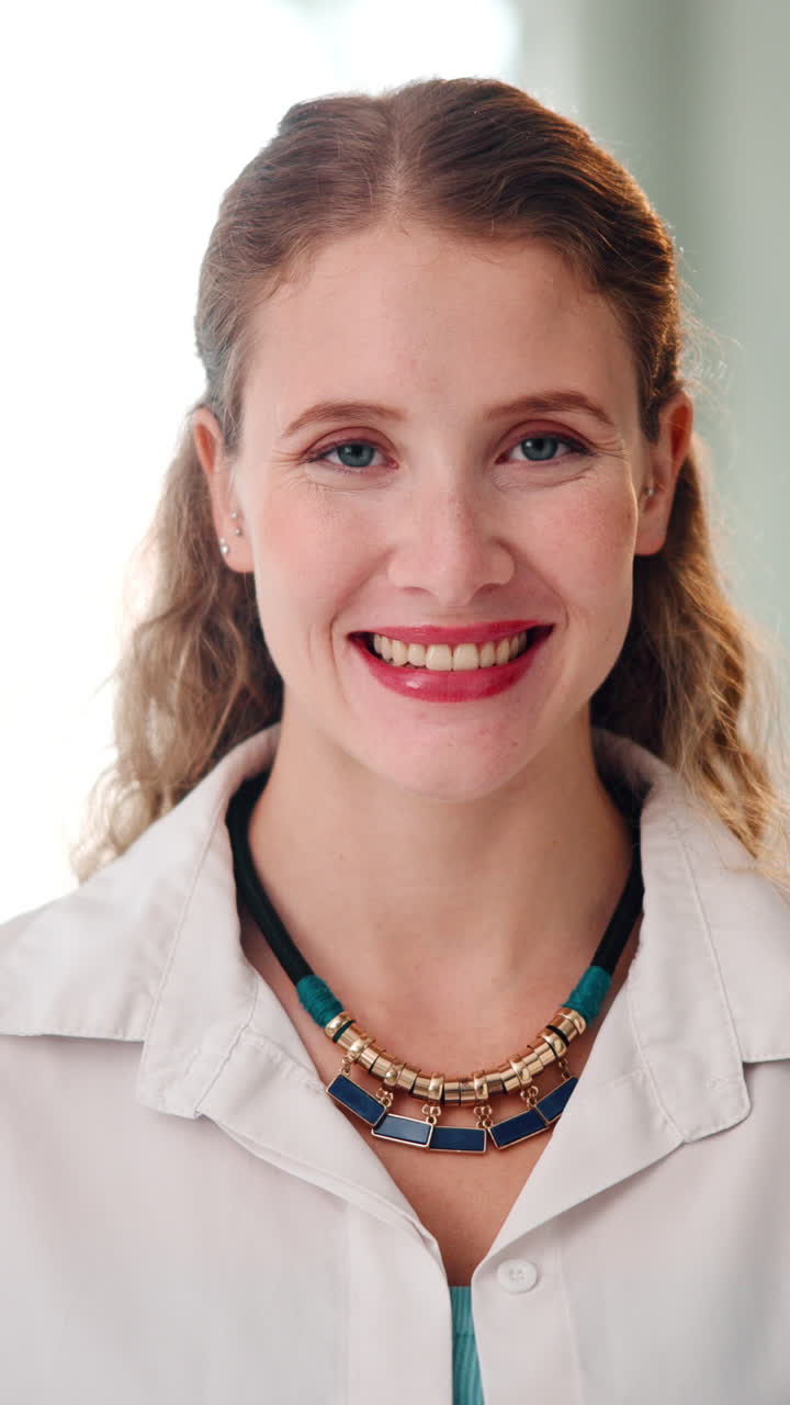 Close Up Portrait of a Happy Young Woman Smiling at Camera